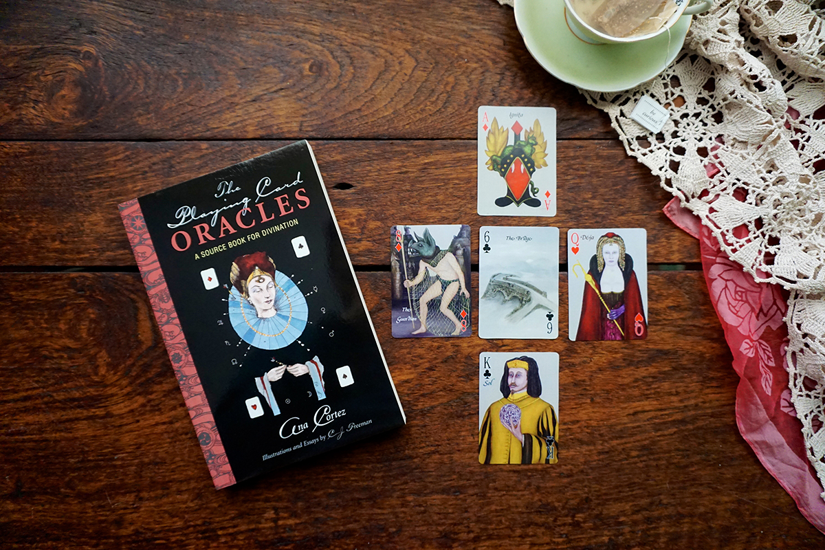 Illustrations help to bring out numerological meanings. An Ace and an Eight appear here in the Element of Fire, a Six and a King in Air, and lovely Queen in Water Element.