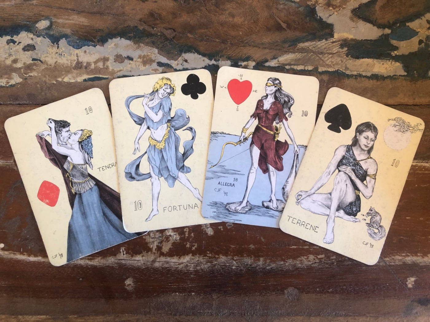 The four Ladies (10s) from The Playing Card Oracles deck by C.J. Freeman: Tendra of Diamonds, Fortuna of Clubs, Allegra of Hearts and Terrene of Spades